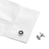 Cufflinks, round in stainless steel with ray pattern and mother-of-pearl snowcap emblem
